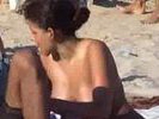 Sexy latina spied on beach with hidden cam, nice looking cutie with lovely big boobies sitting down, that babe gets up and quick glimpse of pussy, hot bitch.