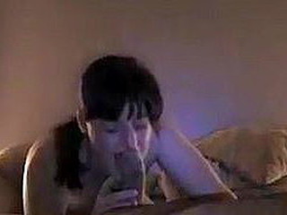 Brunette with a pretty face and naughty look in her eyes gets to sucking the fattest rod of her life. She can't get it in her mouth and focuses her tongue on licking it all around instead!